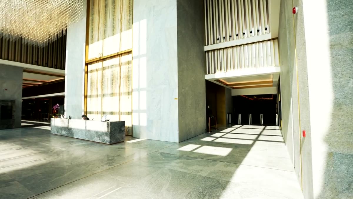The building lobby with reception and vertical timber screening.