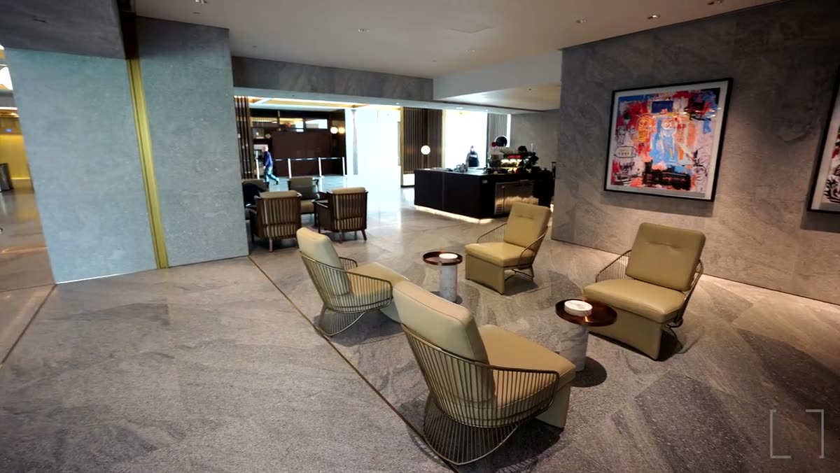 A lounge area with armchairs and side tables.