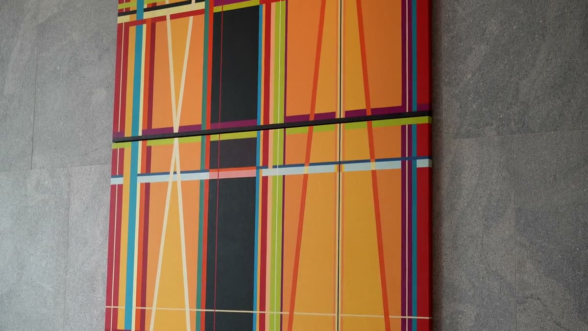 The finished painting on a wall, seen at an angle.