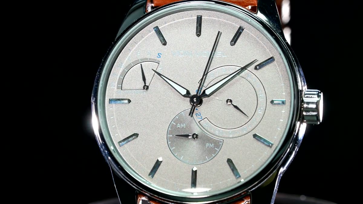The watch shot on black, silver dial and chronograph subdials.