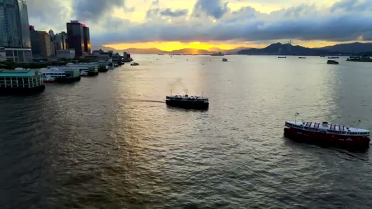 Junks on the harbour at sunset.