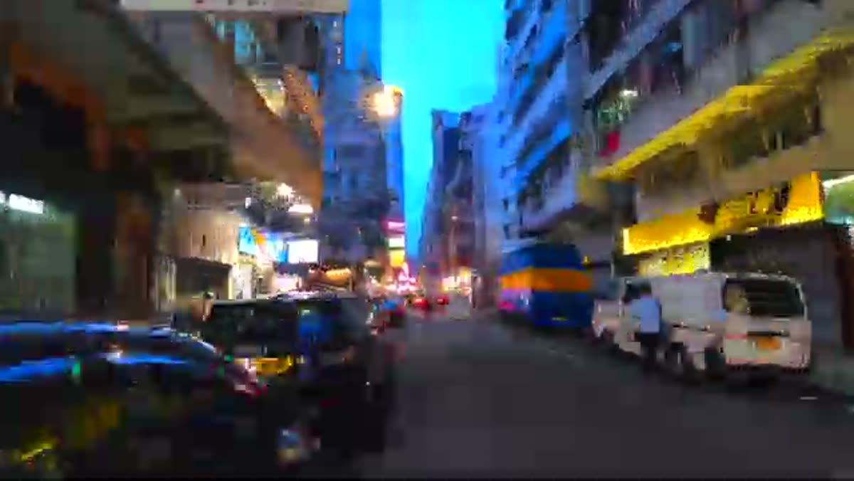 Neon and traffic, after dark.